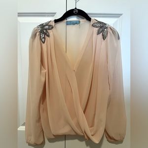 Size small blush pink top with sequins.
